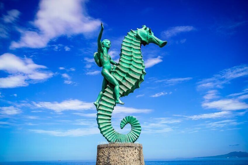 Puerto Vallarta Iconic Sea Horse Statue with a Child riding it.