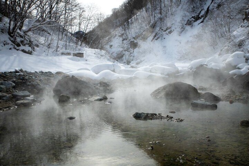 Natural hot spring in the river