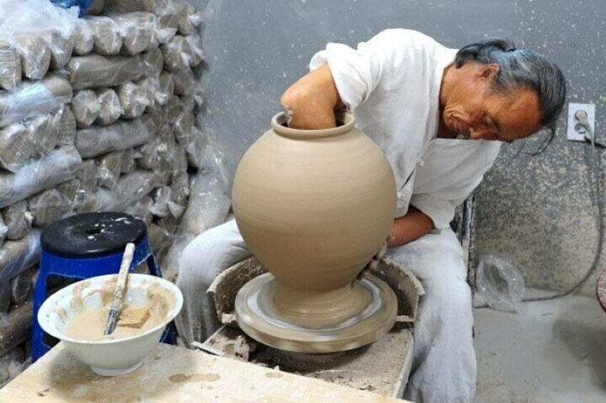 A potter making pottery