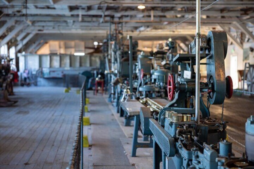 Explore the Retort Room and learn about the intricate canning line machinery. 