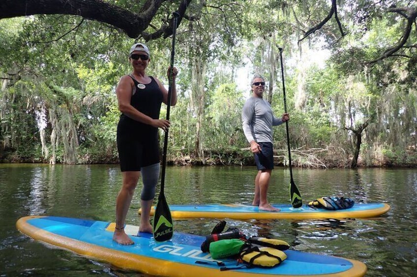 Stand Up Paddle Boarding through the scenic Dora Canal on the Lake Harris Chain of Lakes.