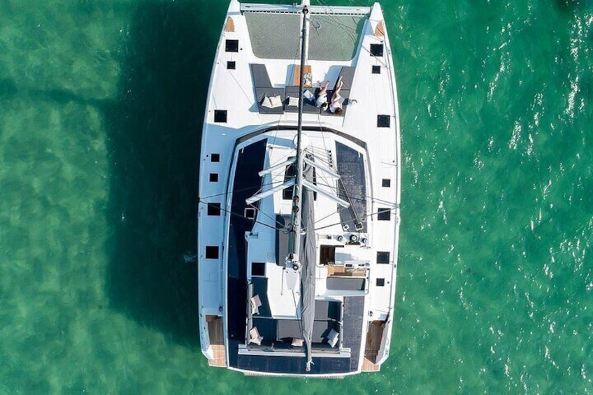 Semi-Private Brand-New Catamaran Cruise in Mykonos with Meal, Drinks & Transport