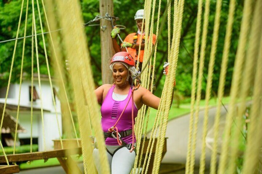 Guest about to climb through the single wooden block 