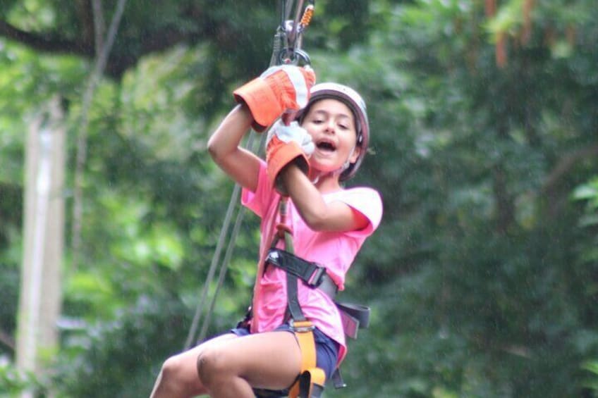 Child enjoying her Zipline at the Harrison's Cave Eco-Adventure Park