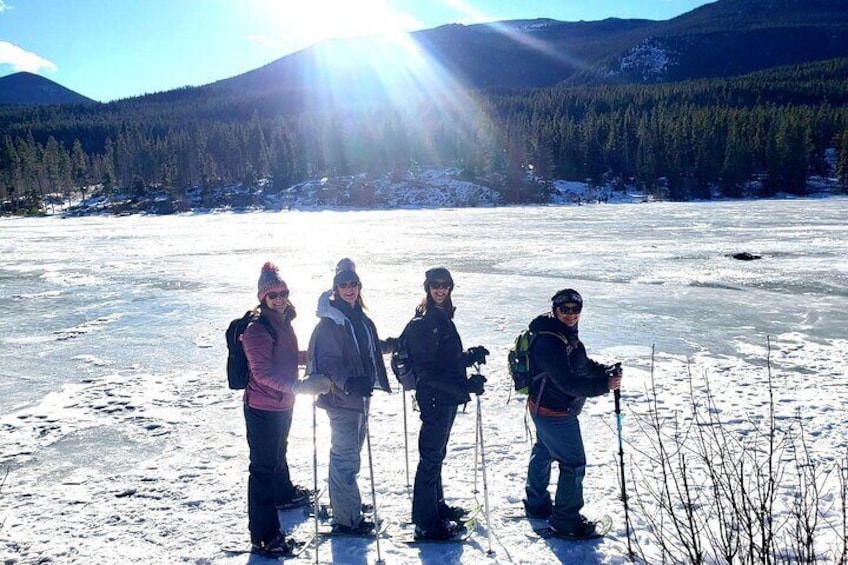 Ladies enjoy a snowshoeing tour at Sprague Lake in Rocky Mountain National Park.