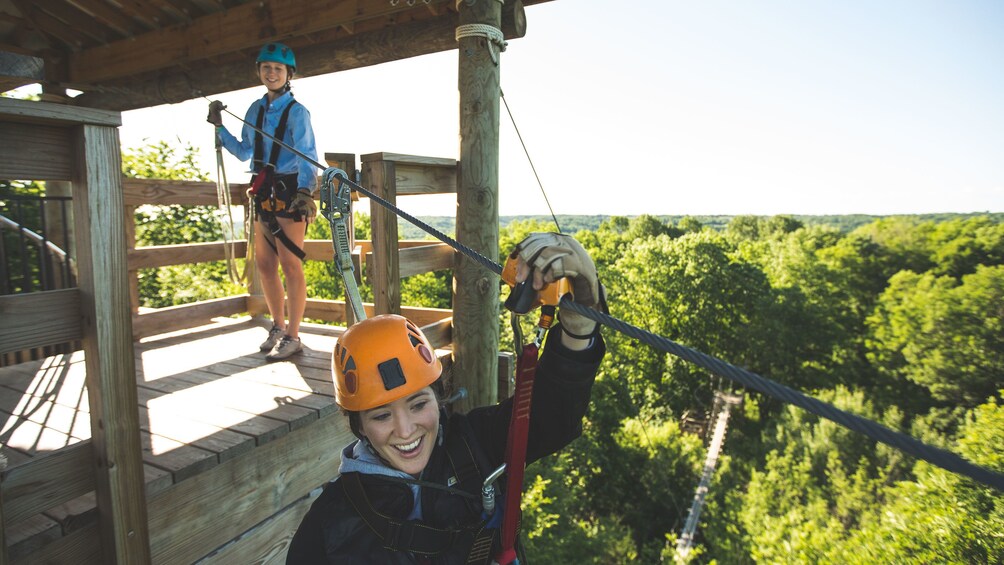 Two girls zipline in Minneapolis