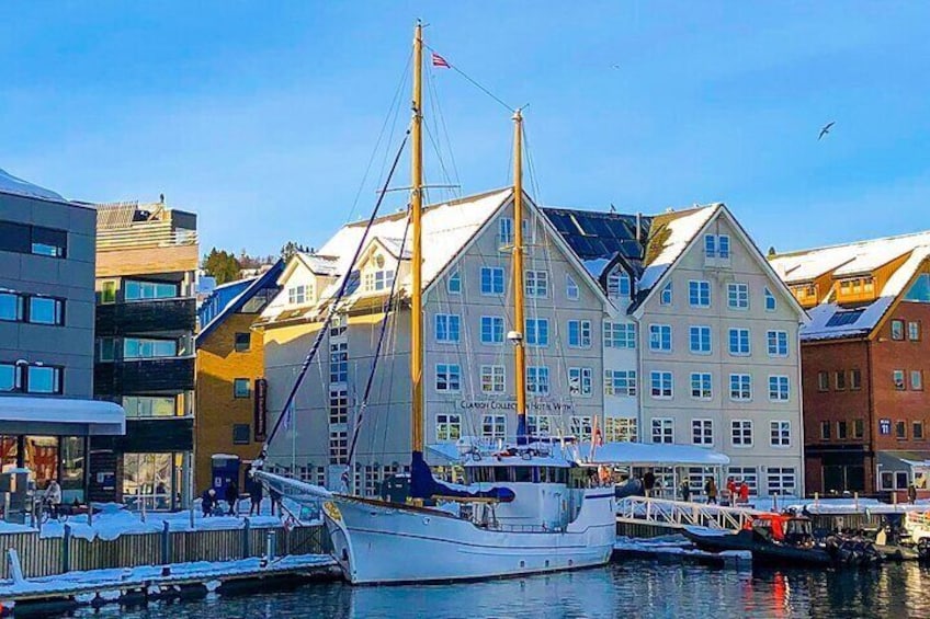 The luxurious sailing yacht, Stella Oceana, gracefully moored in front of the renowned Fiskekompaniet restaurant.