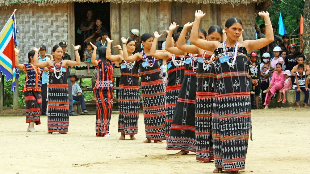 Locals dancing in a village in Hue, Vietnam 