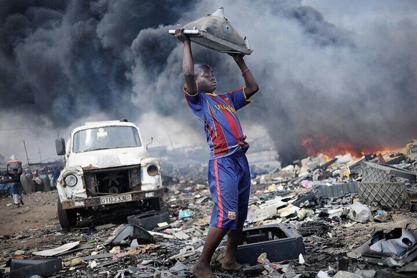 This picture has a lot of deep meaning. Up to 10,000 workers wade through tons of discarded goods as part of an enormous, informal recycling process in what has become one of the world’s largest