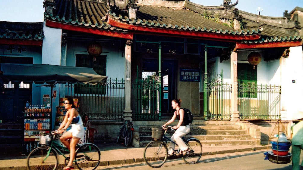 Women bicycling in Laos