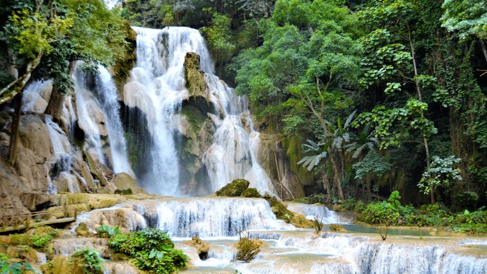 Water cascading down cliffs of Kuang Si Falls in Laos