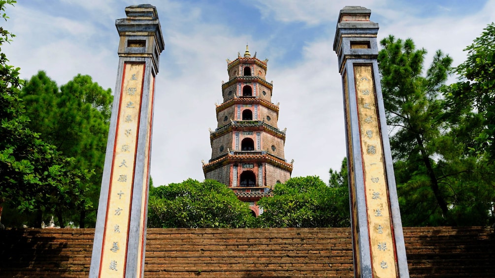 columns and tower rising in background at Thien Mu Pagoda in Hue