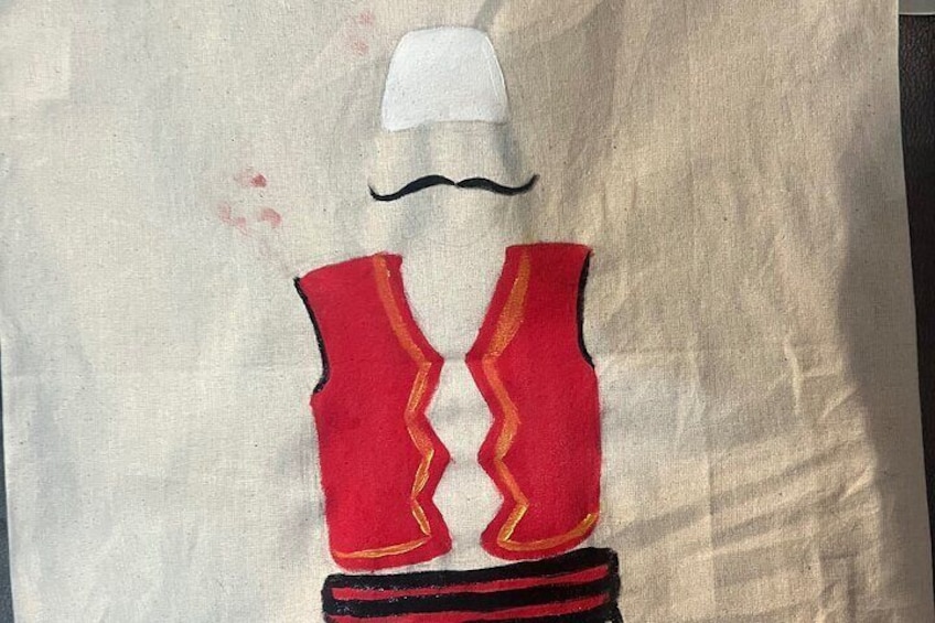 Traditional Albanian costume on totebag, simplified.