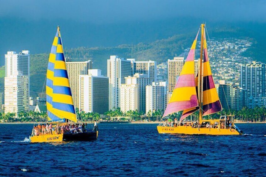 MANU KAI AND KE KAI SAILING THROUGH WAIKIKI