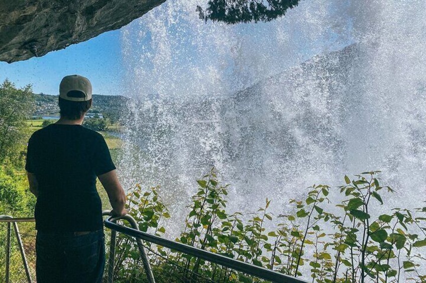 Walk behind the famous Steindalsfossen waterfall.