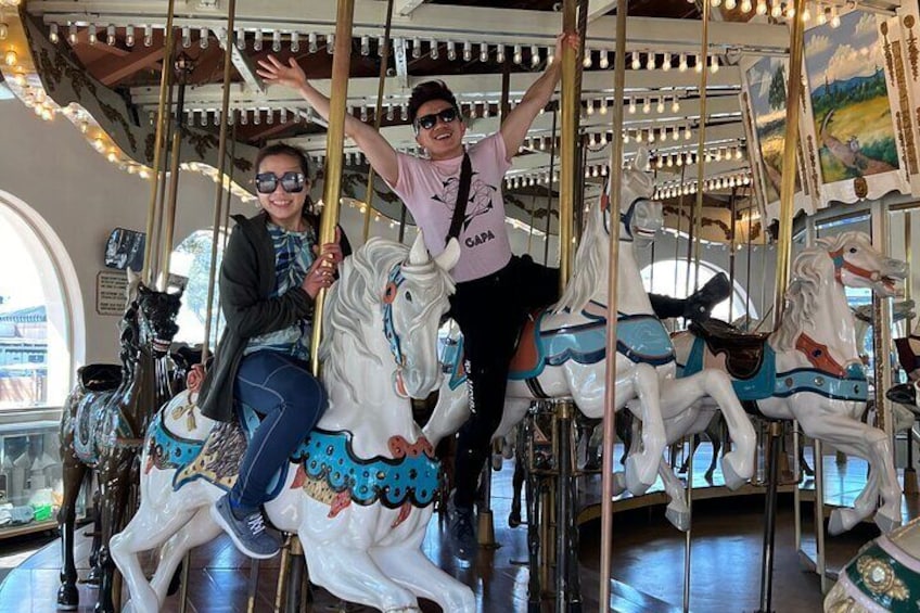 Everyone loves the ride on the historic carousel included on the tour!