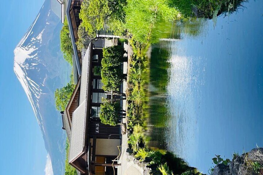 Oshino Hakkai village pond with mount fuji reflection