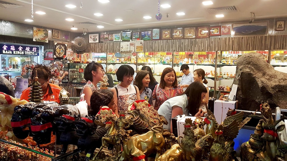 Tour group with guide in market in Singapore