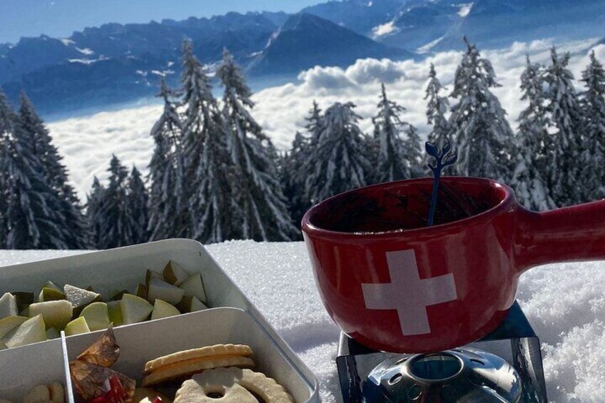 Winter chocolate fondue picnic on the Rigi