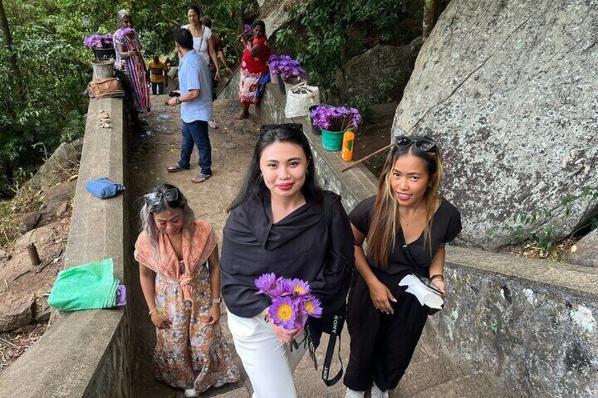 Dambulla cave temple visiting with Lotus flowers to offering buddha