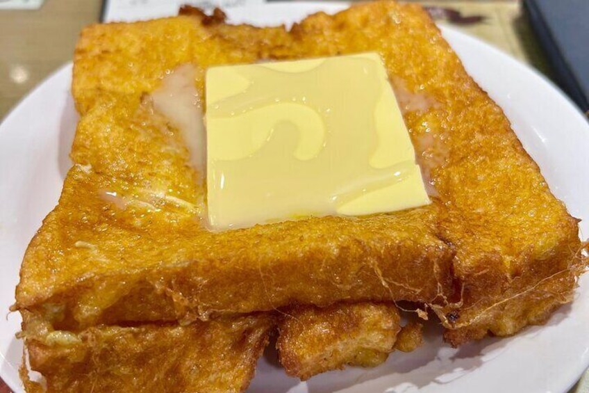 HK French toast, is even more indulgent than its French original style. After being deep-fried, the toast is typically filled with cheese or peanut butter and served with syrup.