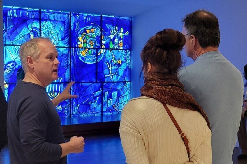 Guide discussing America Windows by Marc Chagall