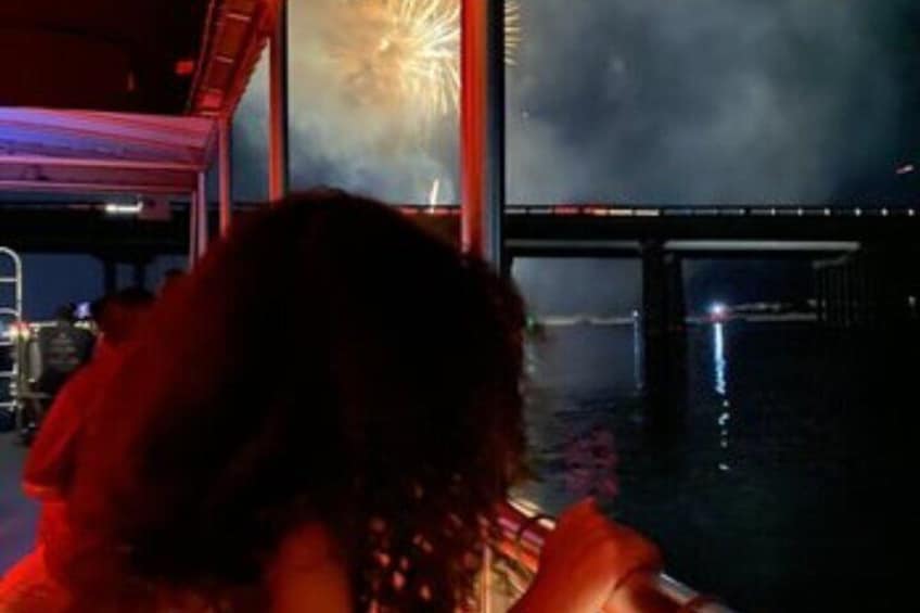 Young Girl on Sunventure Fireworks Cruise Watching Fireworks by the Destin Bridge