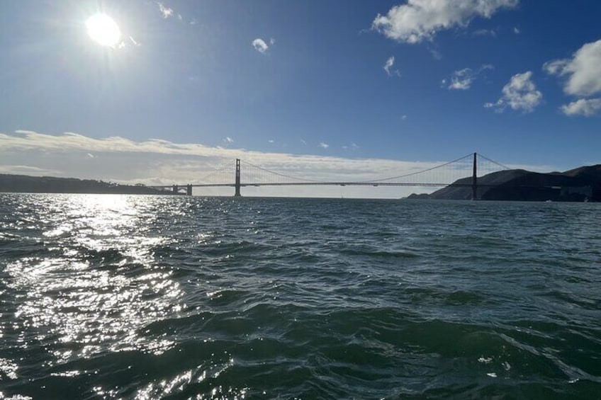 the Sun shinning over the Golden Gate Bridge