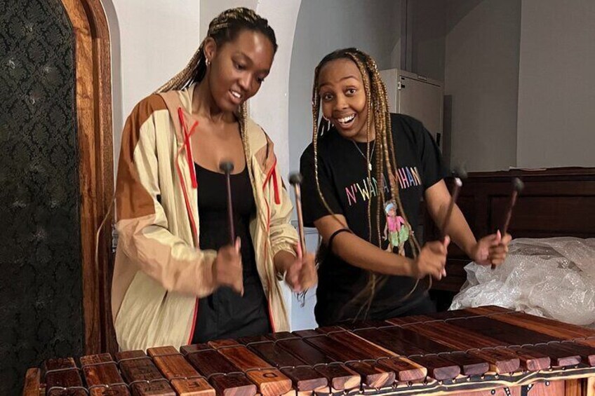 Beginners enjoying their first experience playing the African Marimba
