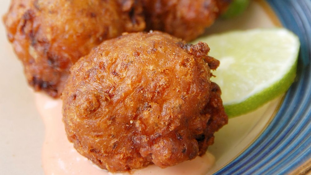 Fried food balls with a slice of lime