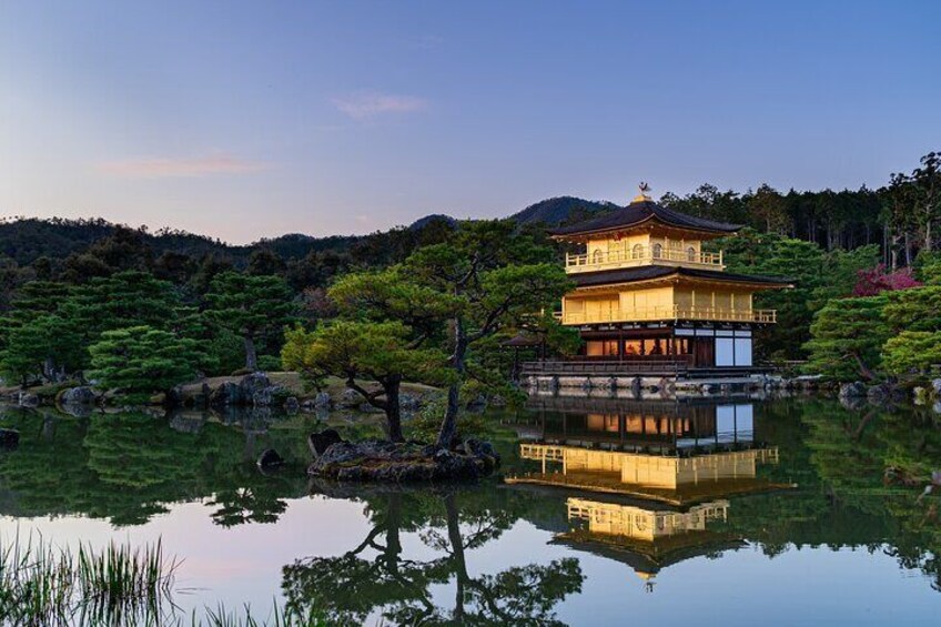 Kinkaku-ji, the Golden Pavilion in Kyoto, is a stunning Zen Buddhist temple with its top two floors covered in gold leaf, creating a breathtaking reflection in the surrounding pond.