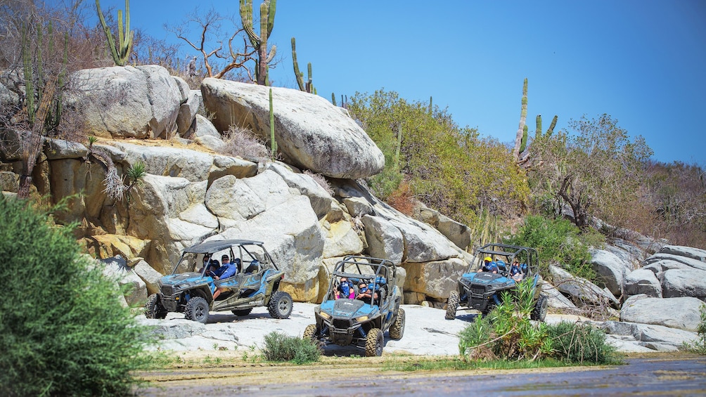 Off-road buggies parked near rivers edge in Los Cabos