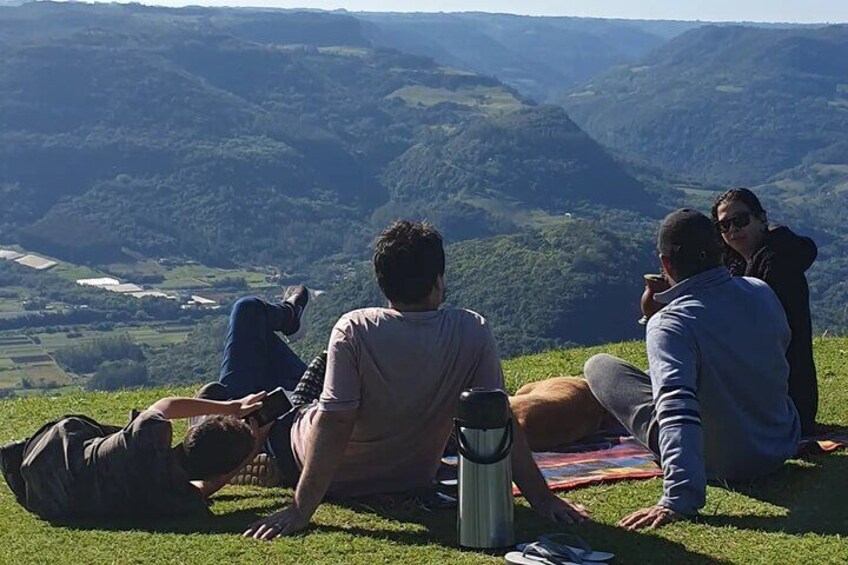 Contemplating the sunset at Ninho das Aguias