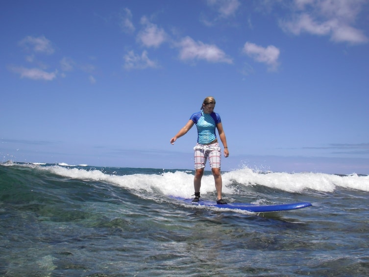 Woman surfing in Hawaii