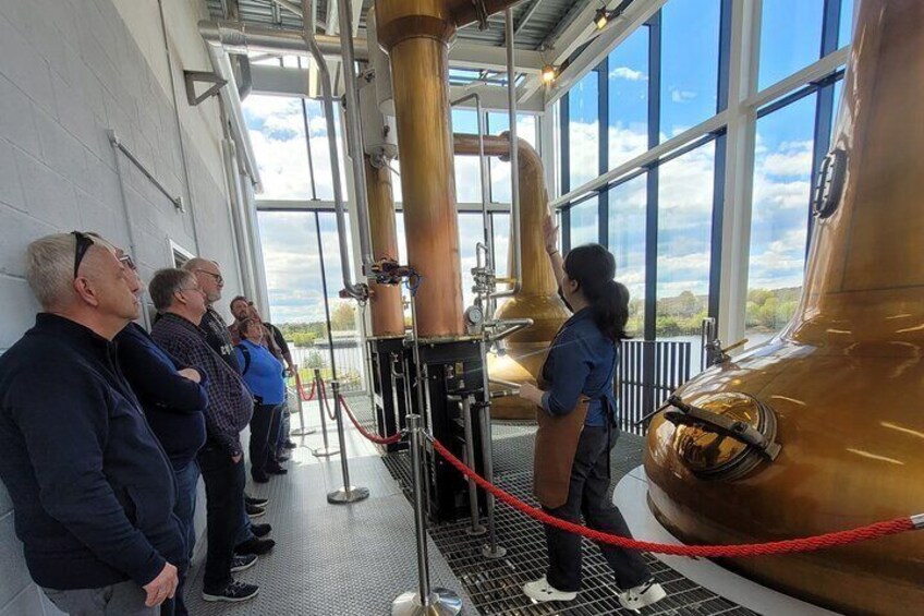 Glasgow e-bike tour guests on their final stop - a tour of Clydeside Distillery