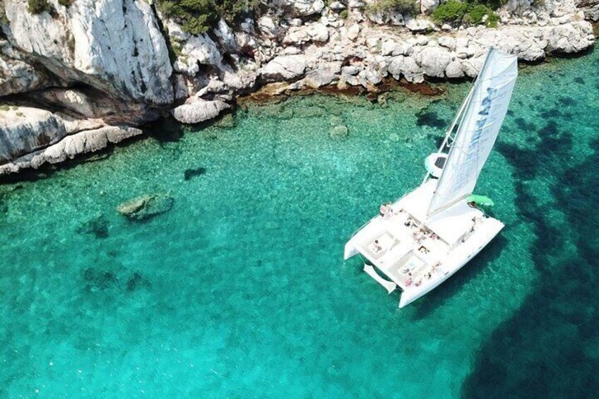 Full day Catamaran cruise in Porto Conte Natural Park