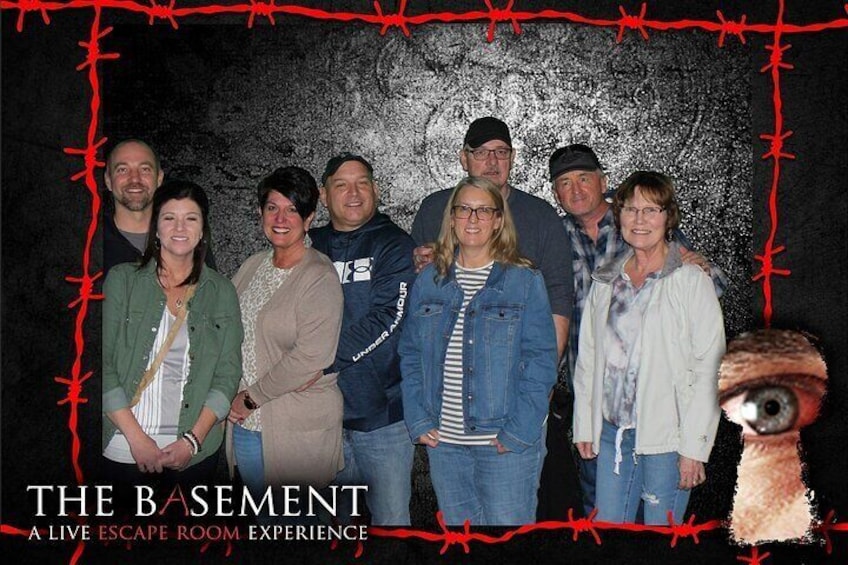 Group souvenir photo at THE BASEMENT: A Live Escape Room Experience in Las Vegas, NV