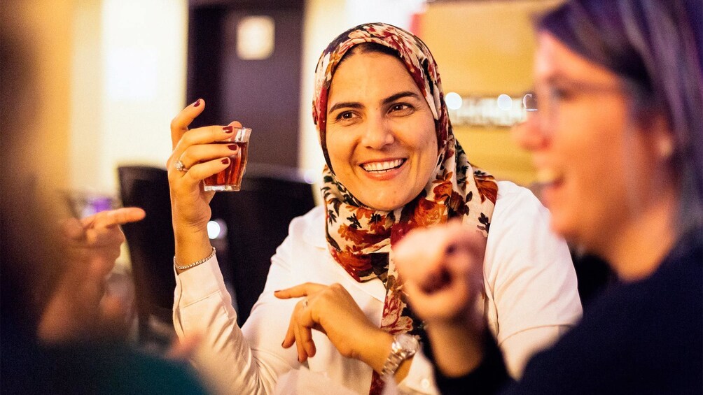 Apri foto 5 di 8. Ladies enjoying drinks on the Dubai by Night Private Tour