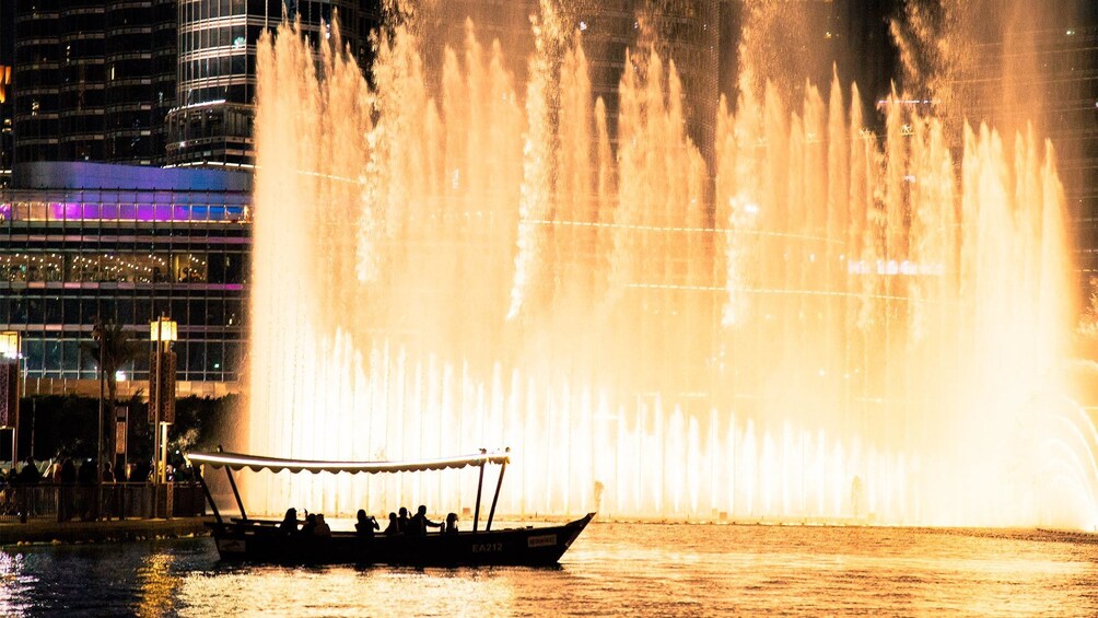 Apri foto 1 di 8. Boat observing a water show on the Dubai by Night Private Tour