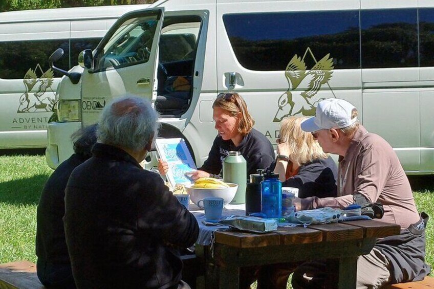 Guide explaining route over morning tea