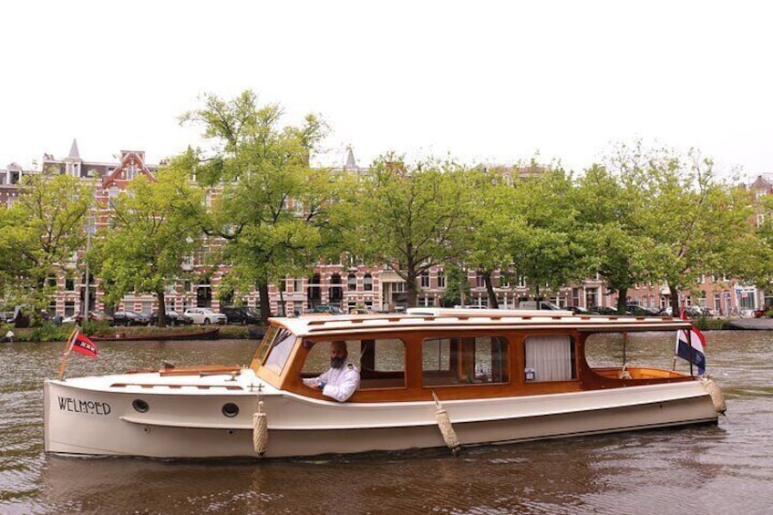 Private Guided Historic Amsterdam Canal Cruise in a Salon Boat