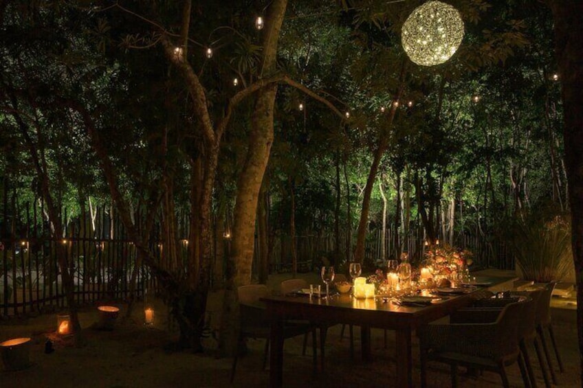 Experience luxury dining in the jungle by candlelight.