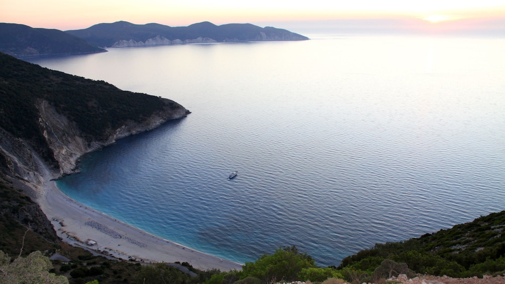 View of Myrtos Beach at sunset on Ionian Islands