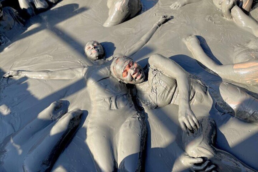 Radiant Smiles: Experience Pure Joy Amidst the Volcanic Mud, Where Morning Energy Is Unmatched.