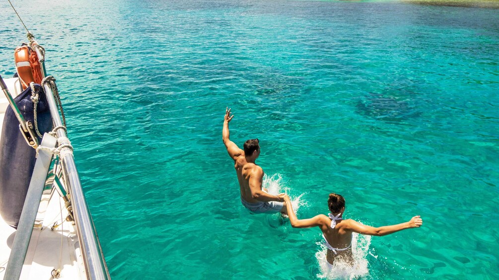 Show item 2 of 5. Guests swimming on the Full Day Reef Safari in Seychelles