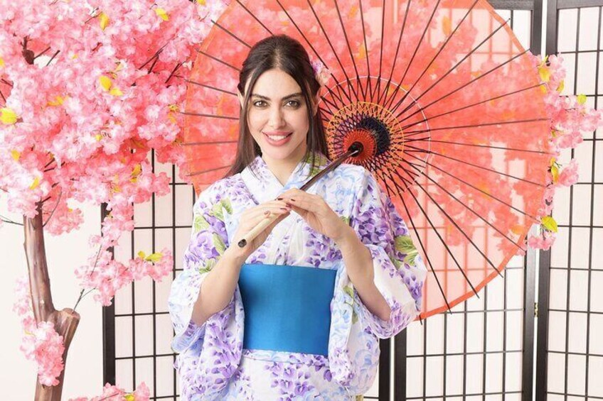 Photographed in a studio wearing a kimono