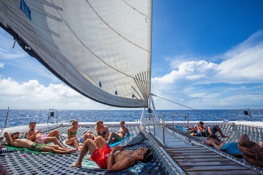 See the sun set on board our catamaran, on your way back from Klein Curacao