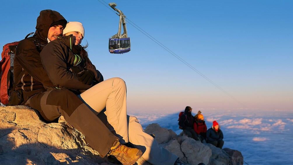 Indlæs billede 1 af 4. Couple embracing at sunset on Teide Volcano in Spain