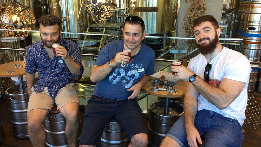 Trio trying beer samples at brewery in Canberra