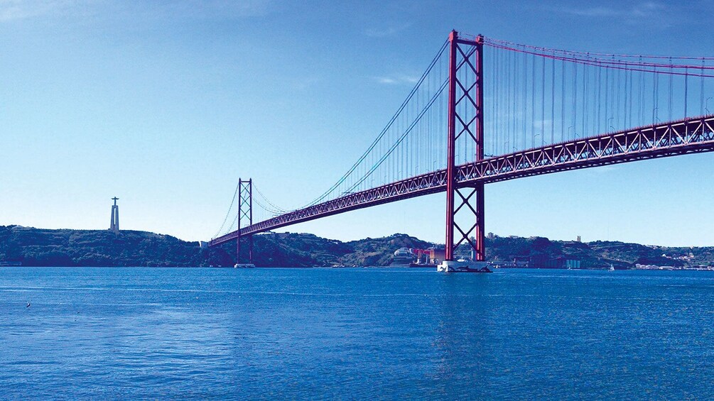 Bridge spanning over large body of water in Lisbon